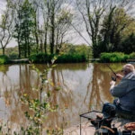 angler fishing at one of yeatheridge farms lakes
