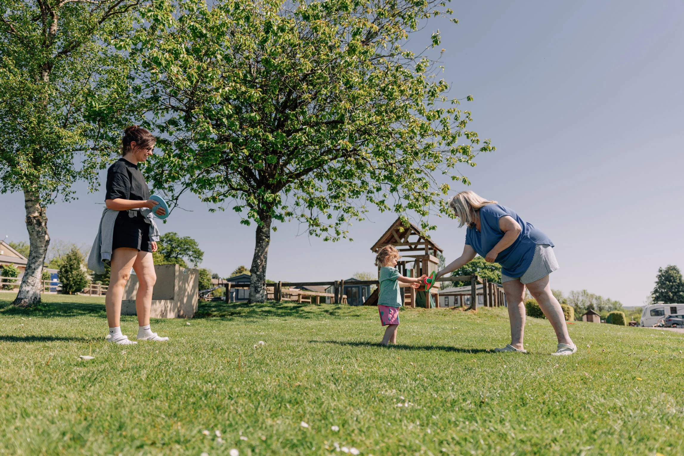 family playing games during a camping trip