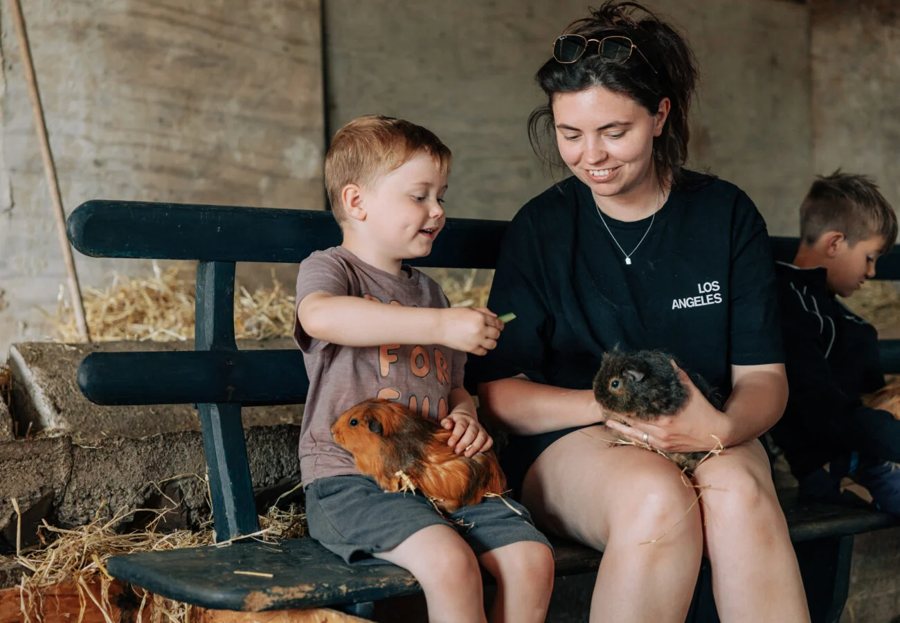 family petting guinea pigs