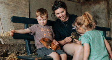 family holding guinea pig