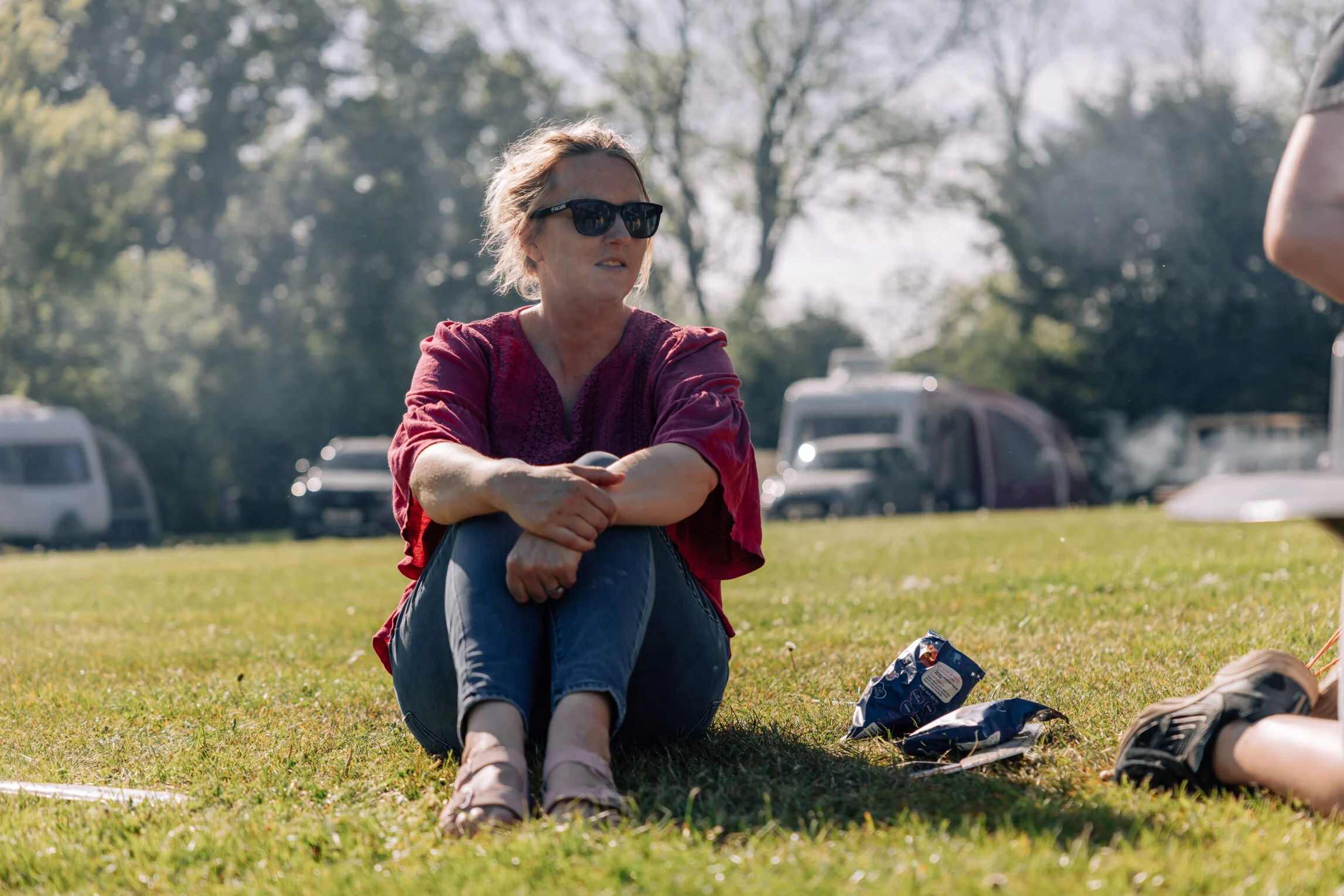 lady sat next to tent