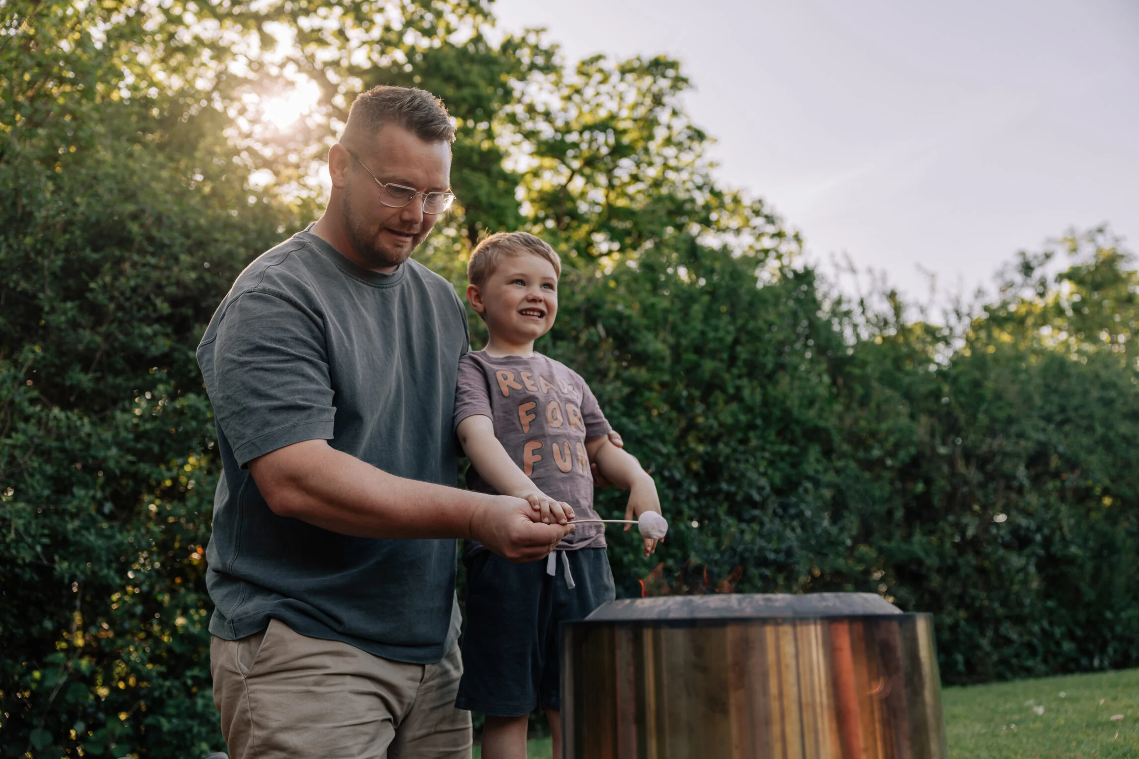 father and child with firepit